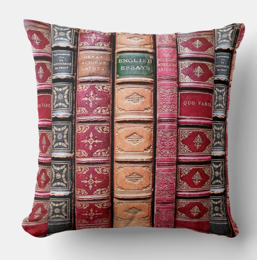 Pillow with a row of Burgundy and beige antique book spines as a gift for bibliophiles