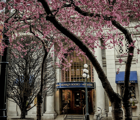 photo of Munro's Books with cherry blossoms above.